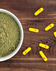 Maximum Strength Kratom capsules spread out on cunter