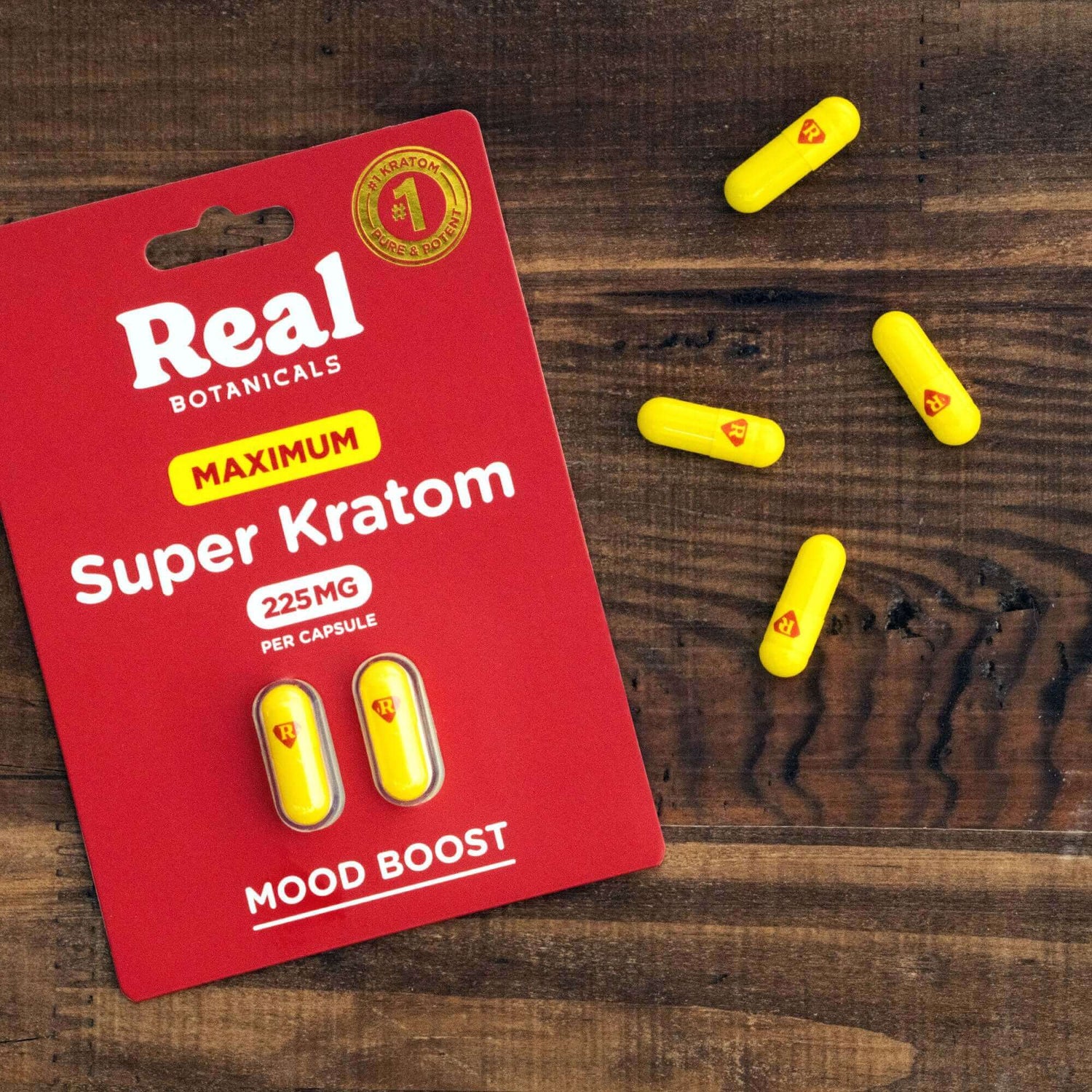 Maxium Strenth Kratom capsules spread out on counter