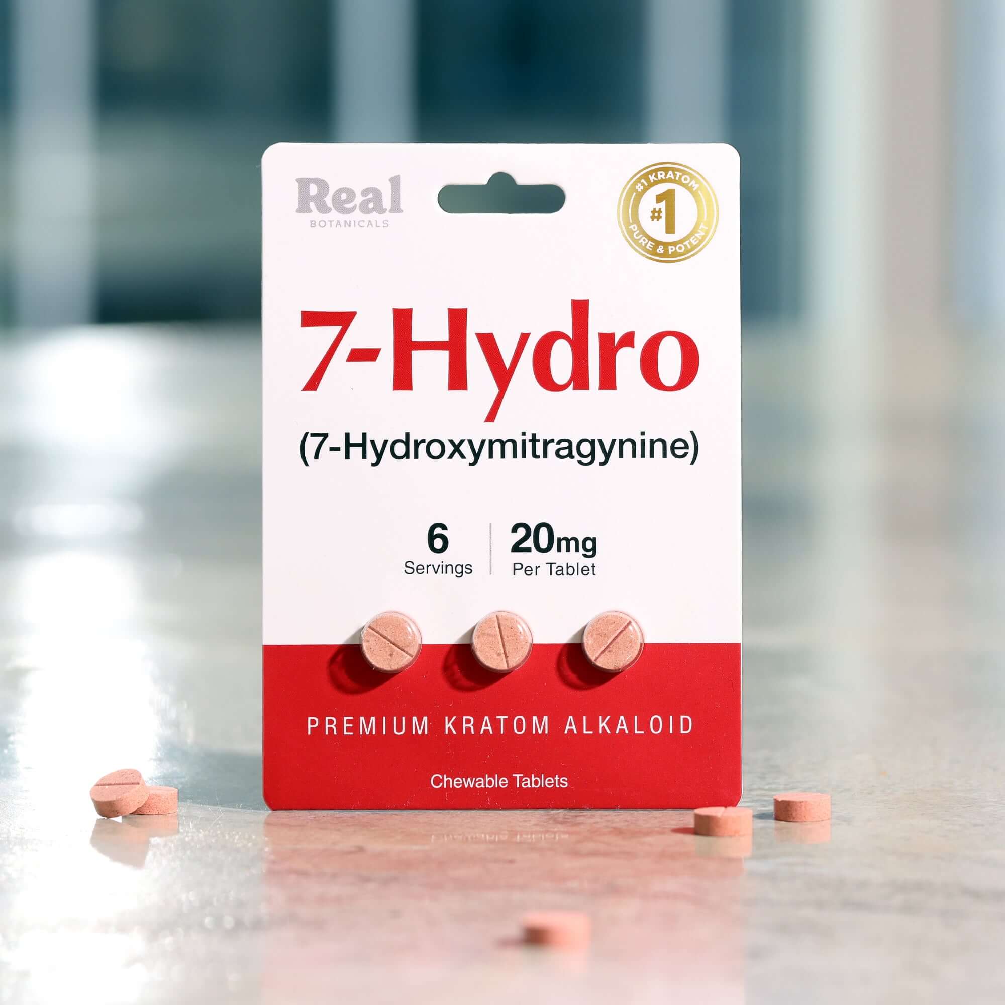 A package labeled 7-Hydro (7-Hydroxymitragynine) with six chewable tablets, each containing 20mg. The packaging is white and red, and the product is described as a premium kratom alkaloid. 