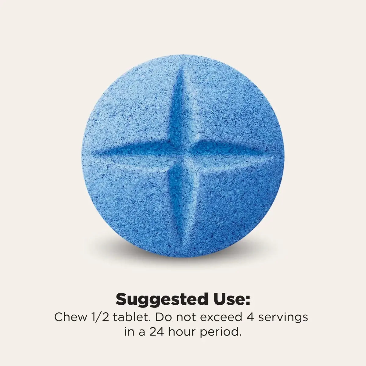 A single round blue tablet with a cross-shaped embossing, shown on a light beige background with text below reading 'Suggested Use: Chew 1/4 tablet. Do not exceed 4 servings in a 24 hour period.