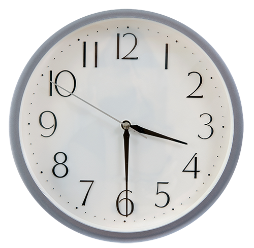 A round wall clock with a white face, black Arabic numerals, black hands, and a gray outer rim, shown against a plain white background.