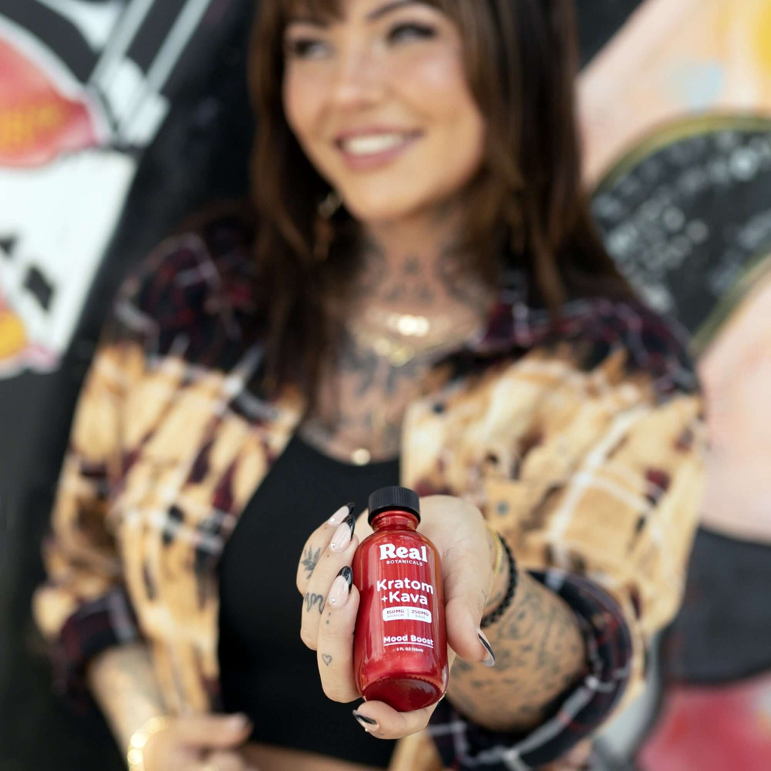 Woman with Kratom and Kava Bottle 