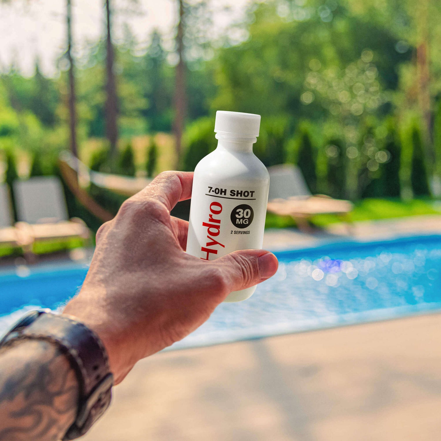 man holding 7-hydroxymitragynine 7-OH Shot at the pool