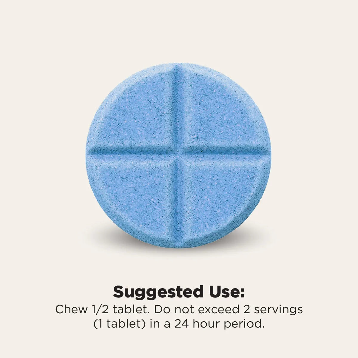 A single round blue tablet with a cross-shaped scoreline, shown on a light beige background with text below reading 'Suggested Use: Chew 1/2 tablet. Do not exceed 2 servings (1 tablet) in a 24 hour period.