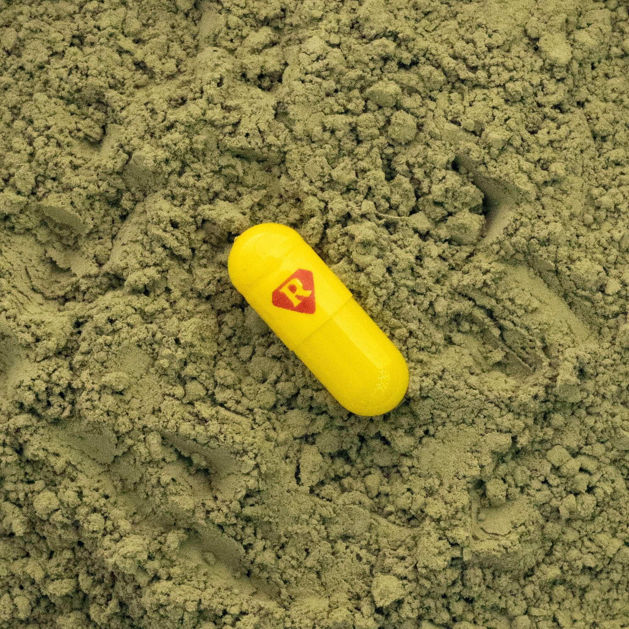 yellow capsule of kratom powder - Real Botanicals